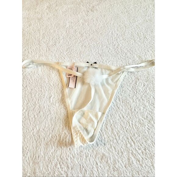 White sheer Victoria’s Secret thong new with tags with black bow detail and pom- - Picture 5 of 6